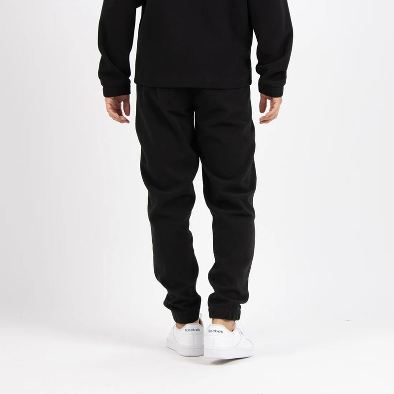 Reebok Pantalon de Jogging en Polaire Noir Homme