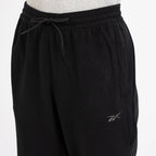 Reebok Pantalon de Jogging en Polaire Noir Homme